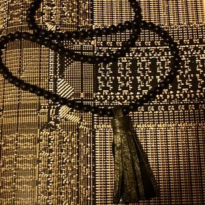 Pretty, black pearls with tassel.